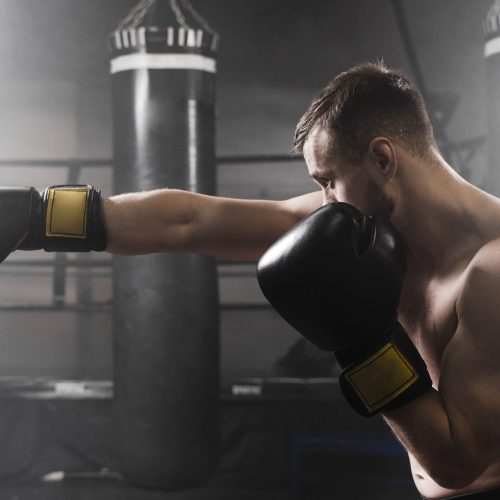sideways-boxer-with-black-gloves-training