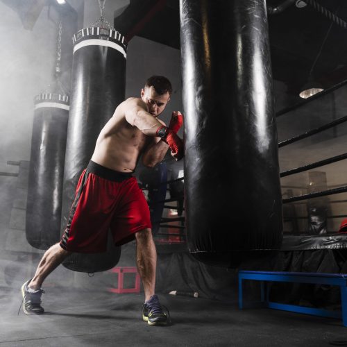 strong-man-with-red-gloves-training